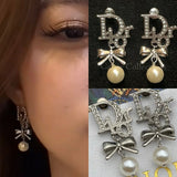 CD Letter Bow Silver Earrings – E016